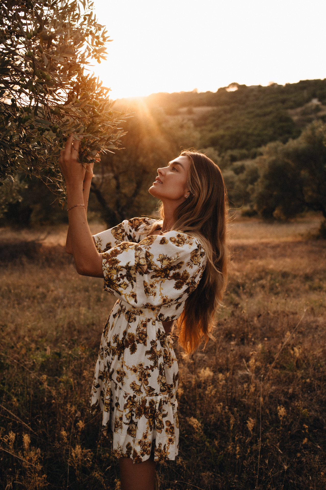 Shayna tending to the ancient olive trees